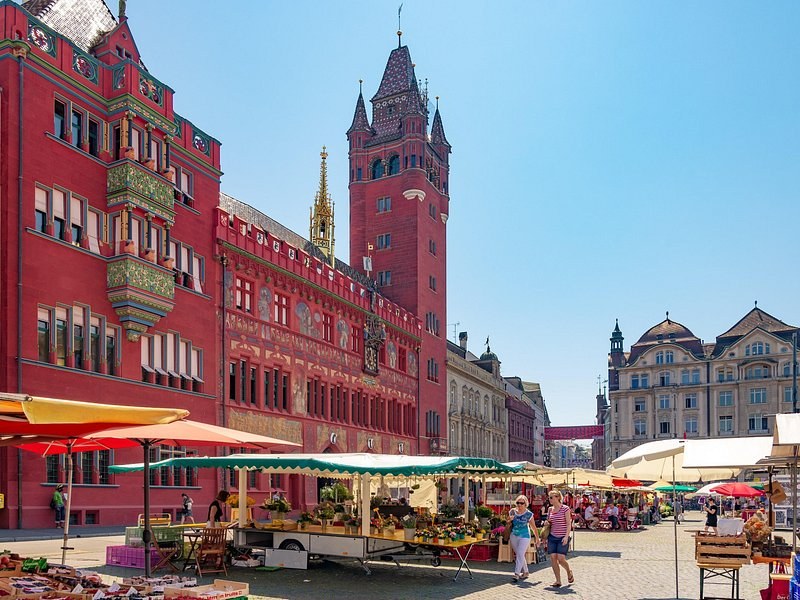 The red Rathaus and its tower over the market stalls on Marktplatz