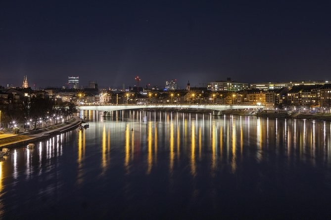 Lights on the Rhine at night, a bridge across the water